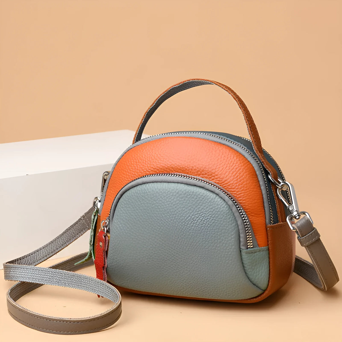 Hand-held crossbody first layer cowhide leather single-shoulder bag in soft round shape with sewing line detail