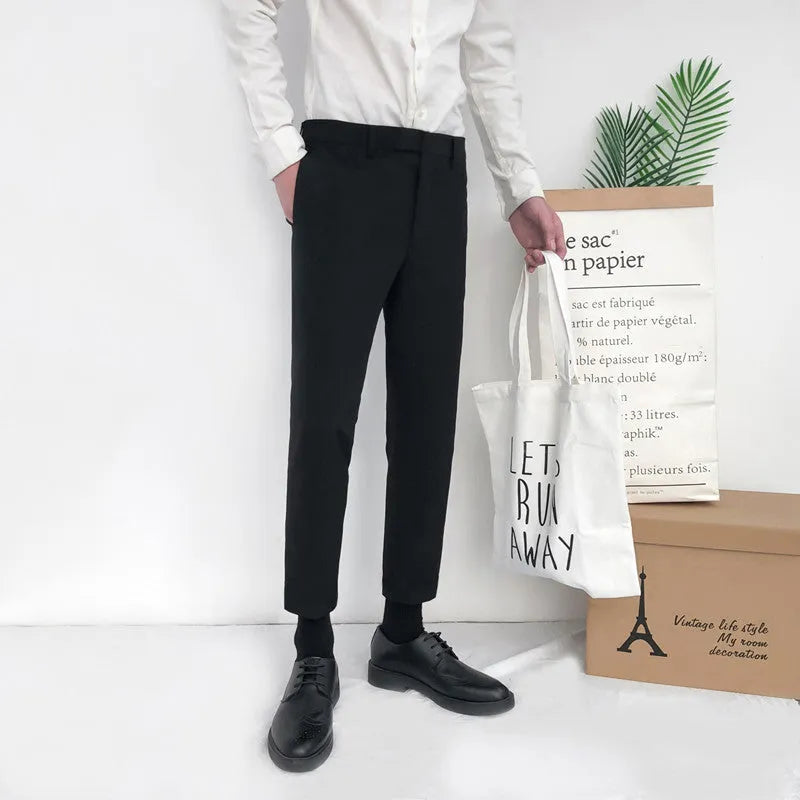 Men's slim straight-leg cotton trousers in black with a drawstring waist.