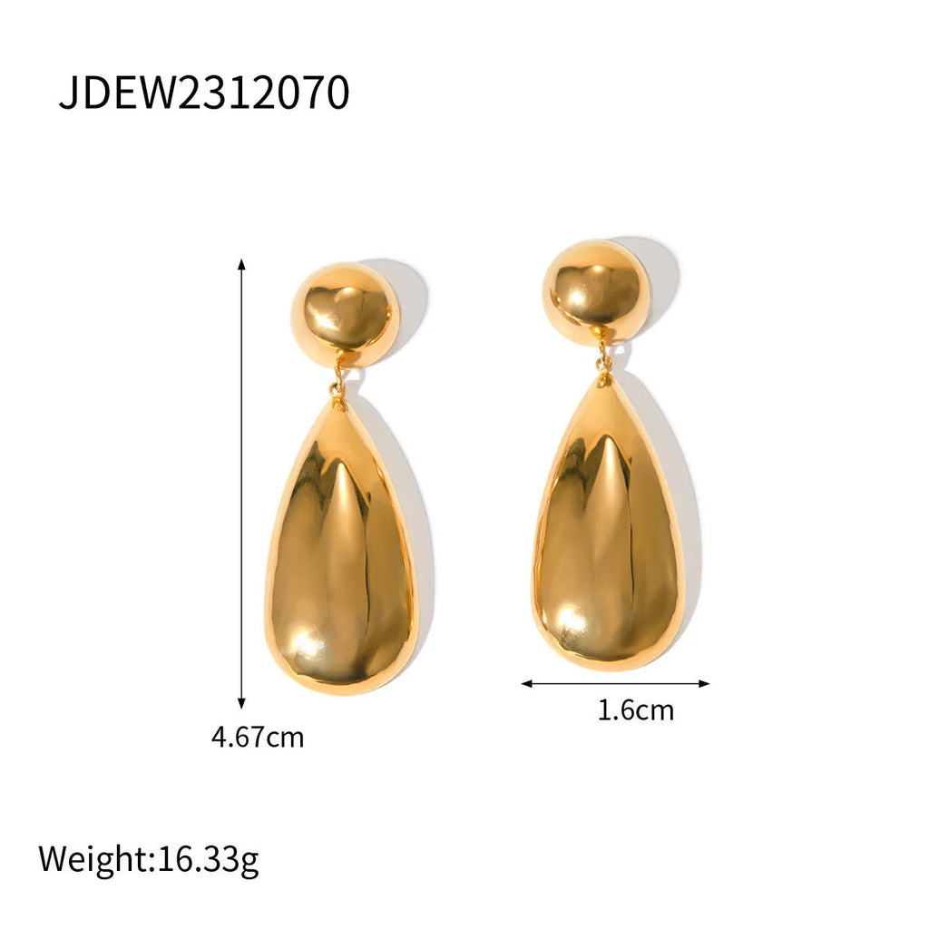 A pair of gold geometric hemisphere earrings with a water droplet pendant design on a white background.