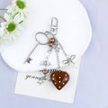 Retro zinc alloy key ring with bow and love heart chain design in multiple colour options