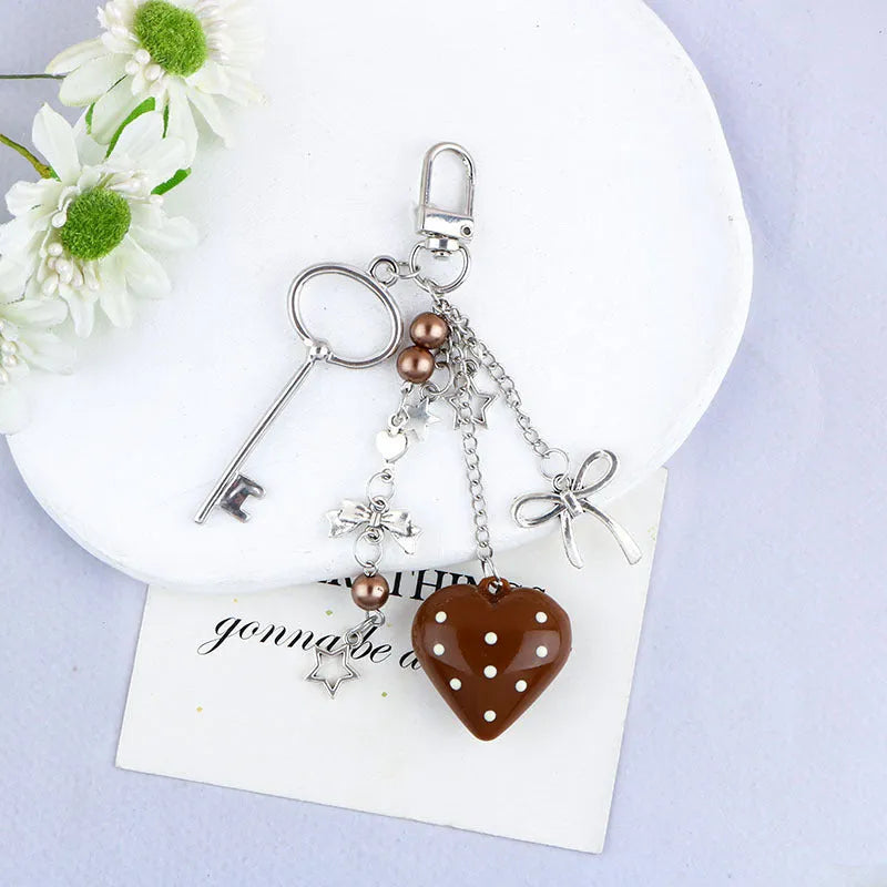 Retro zinc alloy key ring with bow and love heart chain design in multiple colour options