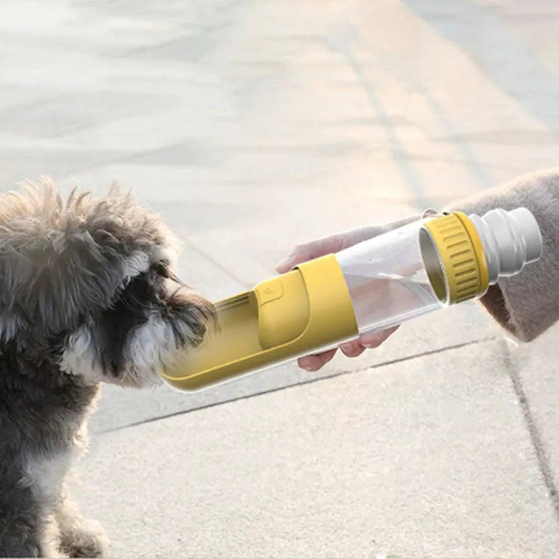 Dark blue portable dog water bottle with built-in bowl and carry handle.
