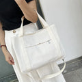Large canvas tote bag with internal organisation pockets in neutral colour