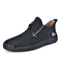 Men's black leather casual boot with front zip, round toe, and rubber sole on a white background.
