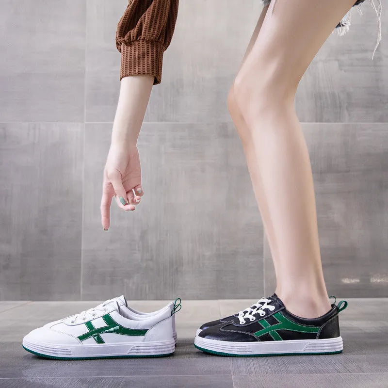 Women's black and white cowhide leather sneakers with elastic band fastening and rubber soles