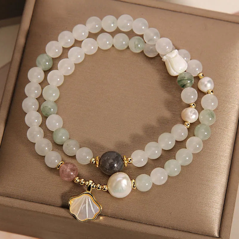 Women's crystal bracelet with a green Tianshan jade shell ginkgo leaf pendant, gold-plated accents, and rhinestones.