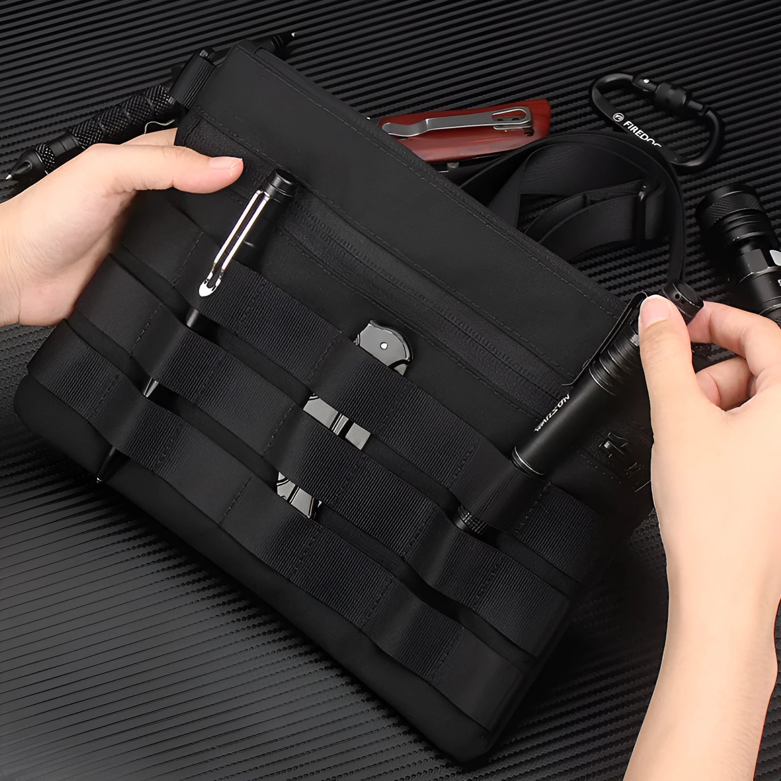 Black Oxford cloth military style outdoor carry bag measuring 18 by 3.5 centimetres