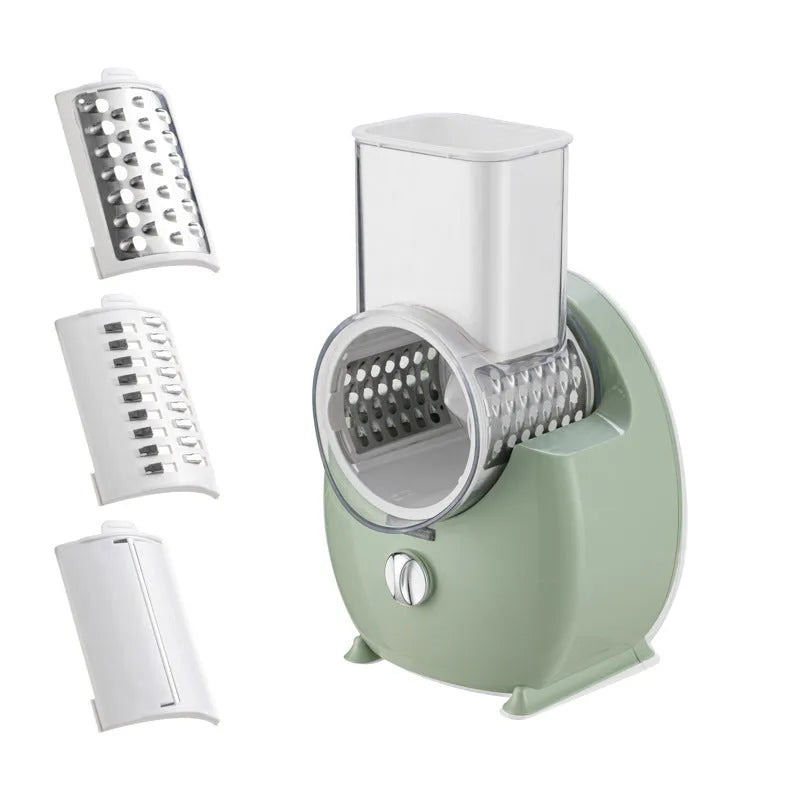 White electric vegetable slicer with rotary grater, blade barrel, and suction base on a kitchen counter.