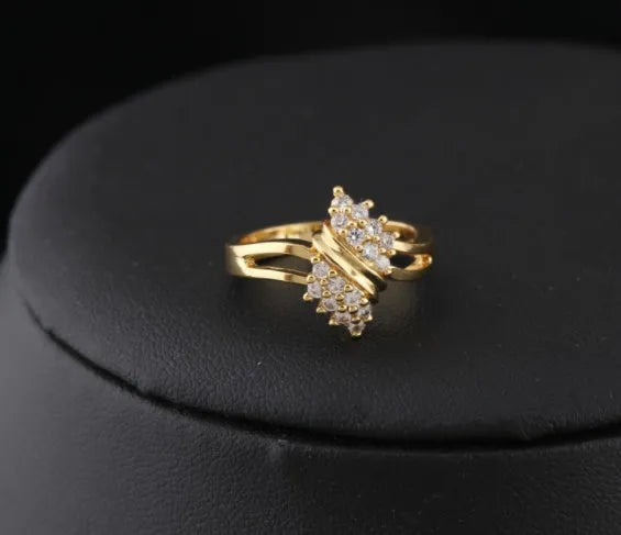 Girls fashion Korean style gold-coloured copper zircon ring on white background