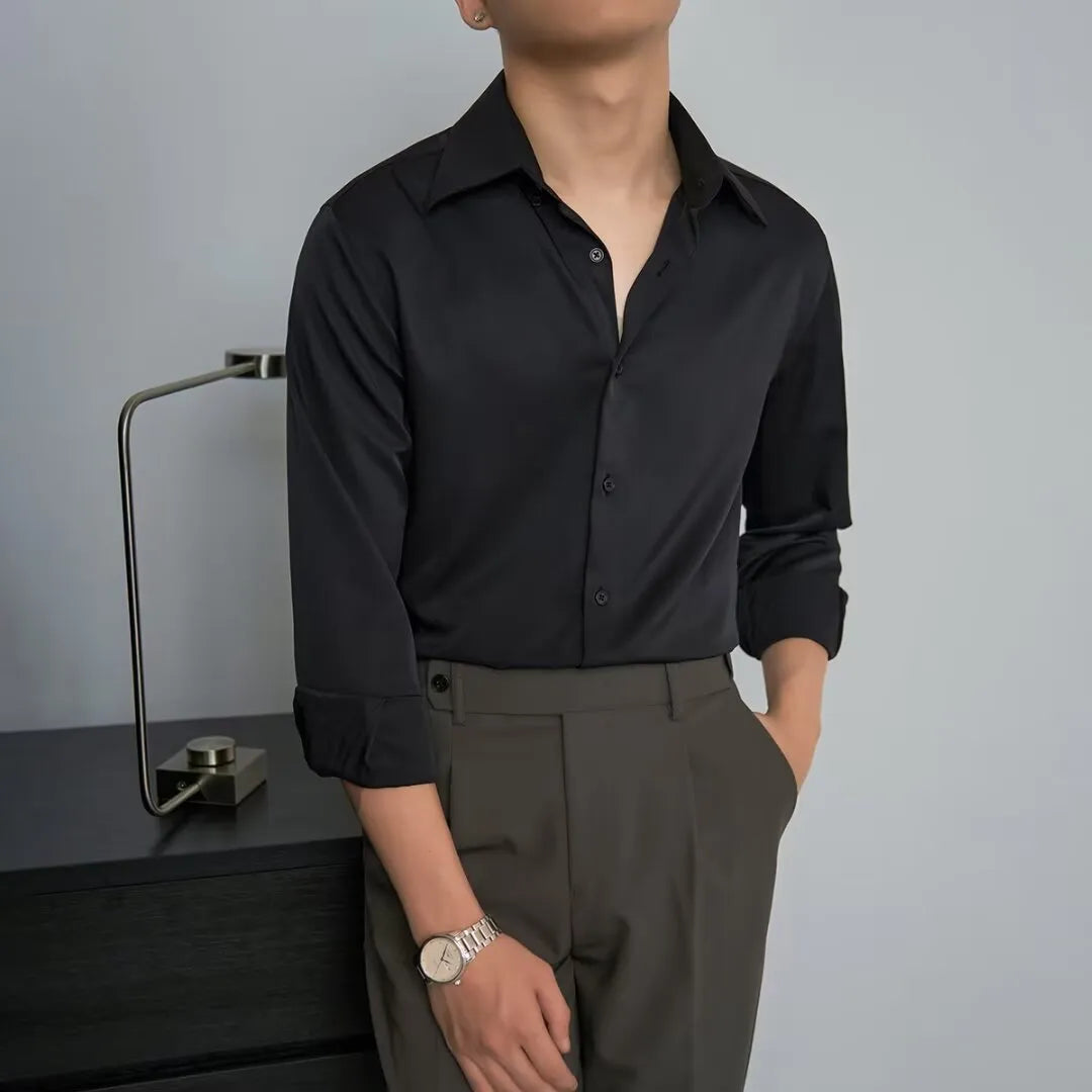 Man wearing a black Japanese retro style loose fit cardigan shirt with long sleeves.