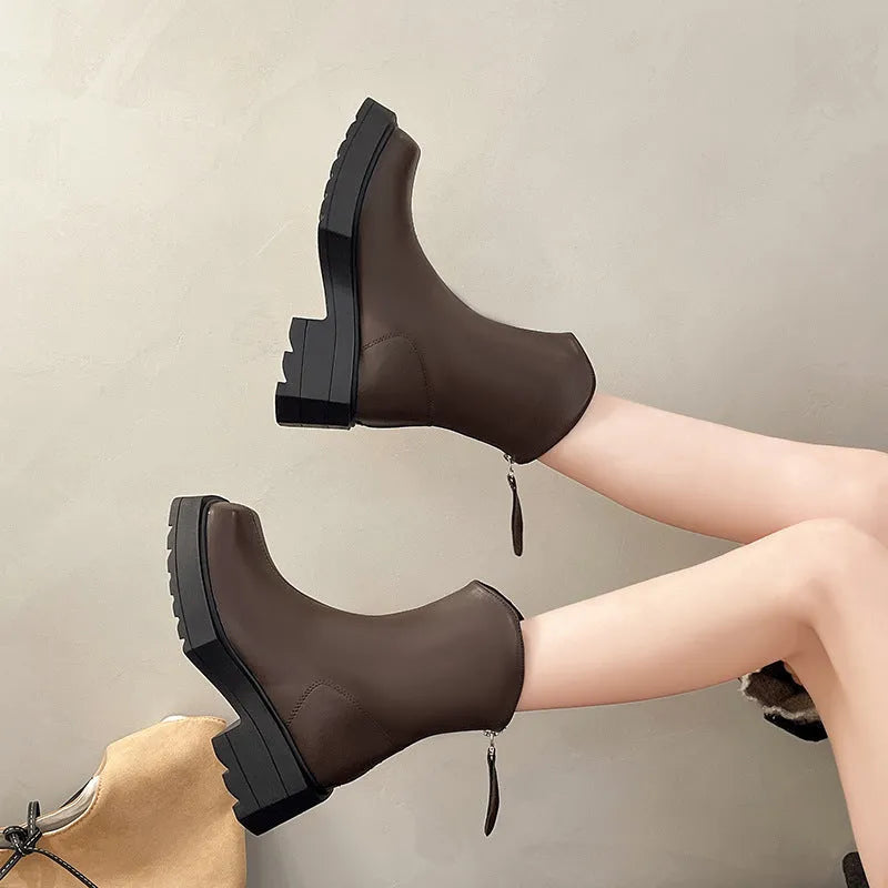 Black and brown women's square toe platform Martin boots with a mid calf height and back zipper.