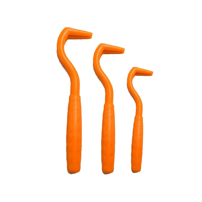 Pack of three coloured plastic tick removal hooks for dogs on a plain background.