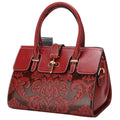 Women's oval vintage crossbody handbag in genuine leather with embossing details and internal organisers
