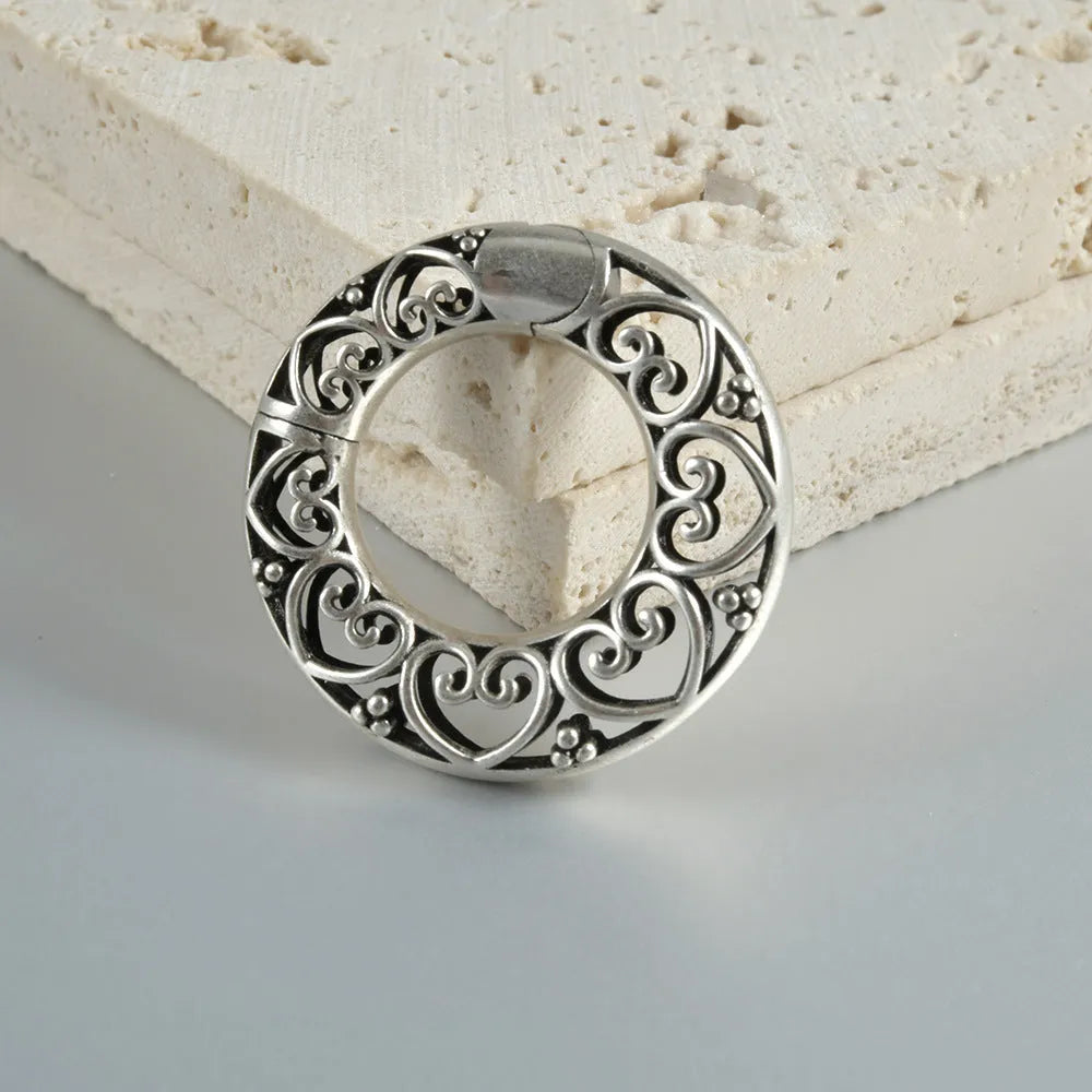 Retro heart-shaped hollow lotus magnetic earrings in antique silver and ancient gold finishes