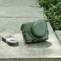 Black imitation leather portable card camera bag with crossbody strap on a solid background