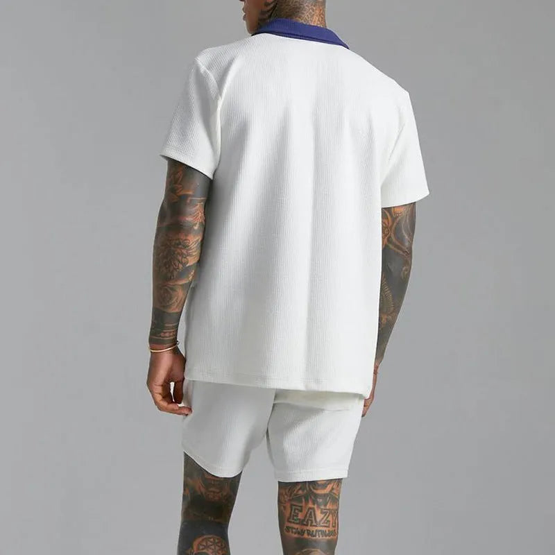 Men's two-piece suit in polyester cloth with printed design, available in black or white