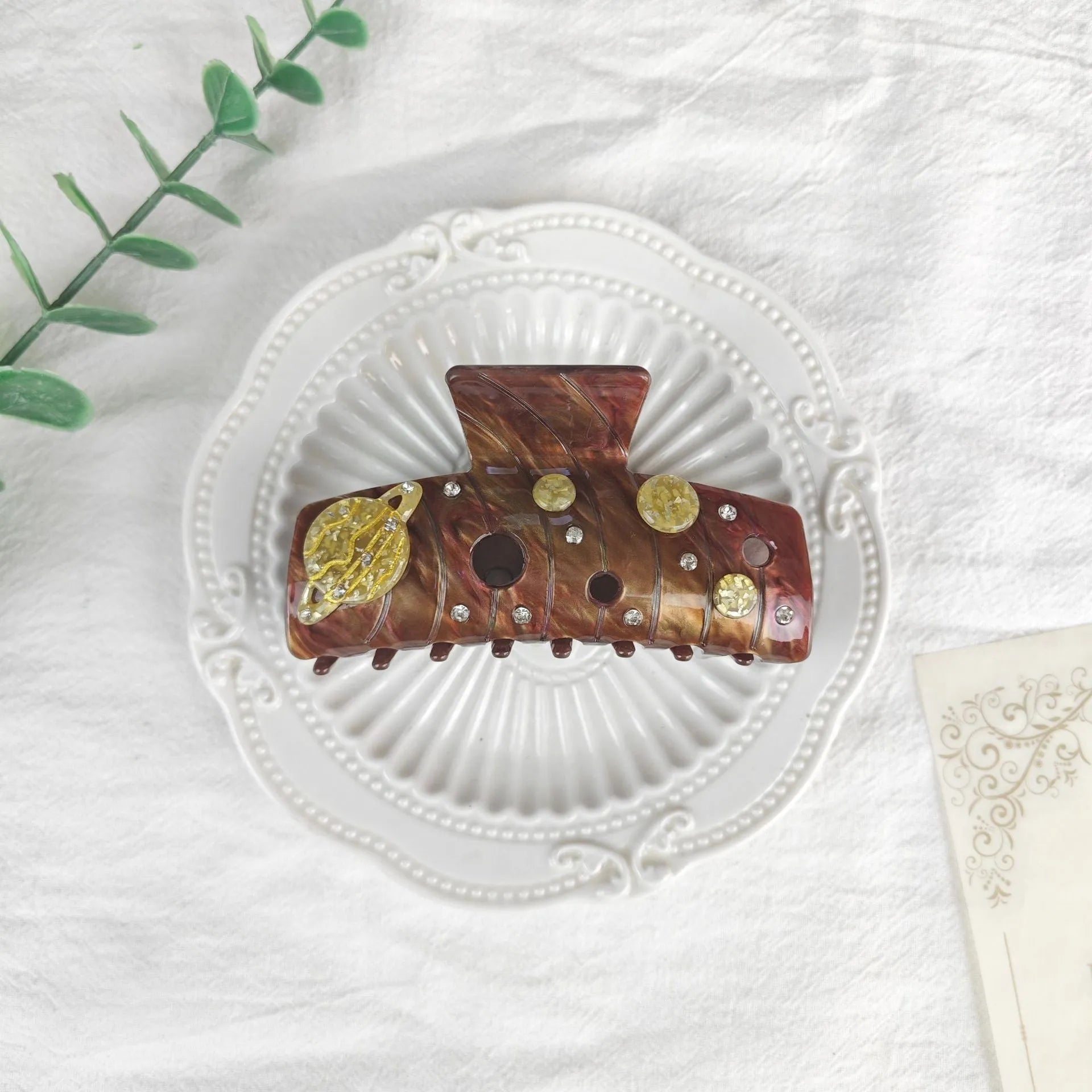 Oversized star moon barrettes with starry sky patterns in multiple colour options