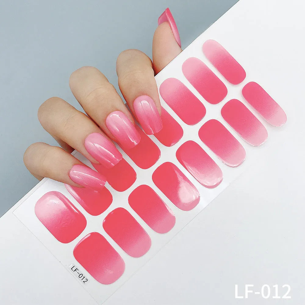 16 solid colour full nail art stickers with 22 patterns including cross, rose, butterfly designs in 12x6mm oval size