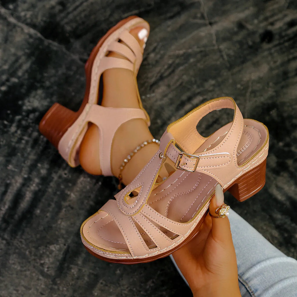 Women's black peep toe wedge sandals with a buckle strap on a polyurethane sole.