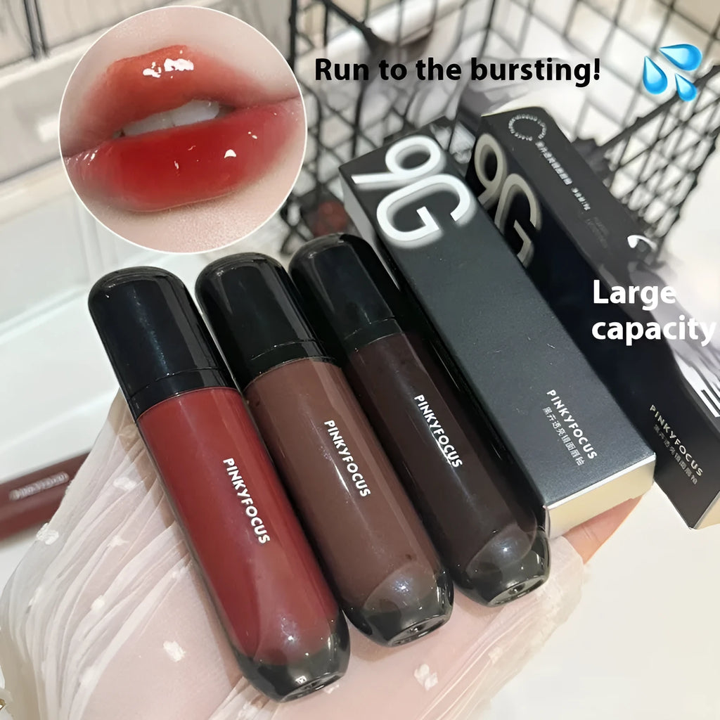 Black shiny mirror lip lacquer tube with glossy finish, shown alongside swatches of its six colour shades.