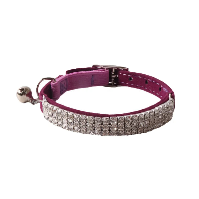 A pink flocked cat collar with an elastic silver buckle, showing its 1.0 cm width and adjustable 28 cm length.