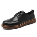 Casual round-toe leather shoes in brown with a flat rubber sole and sewing line details