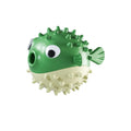 Green fish-shaped interactive dog chew toy with textured surface for treat dispensing and teeth cleaning.