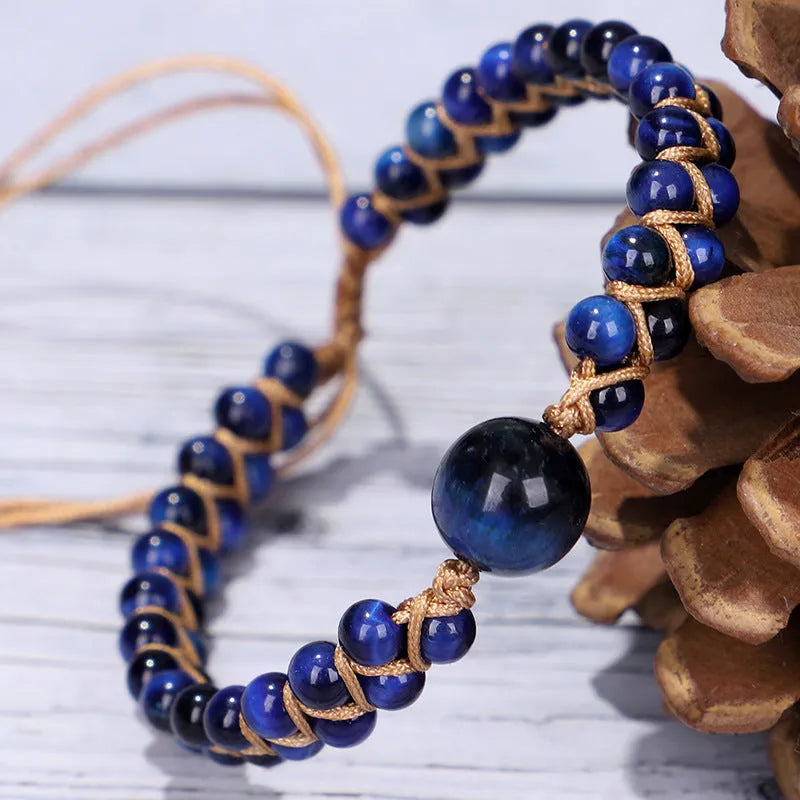 Handmade woven geometric pull bracelet in Tigereye stone showing blue and amethyst colour options
