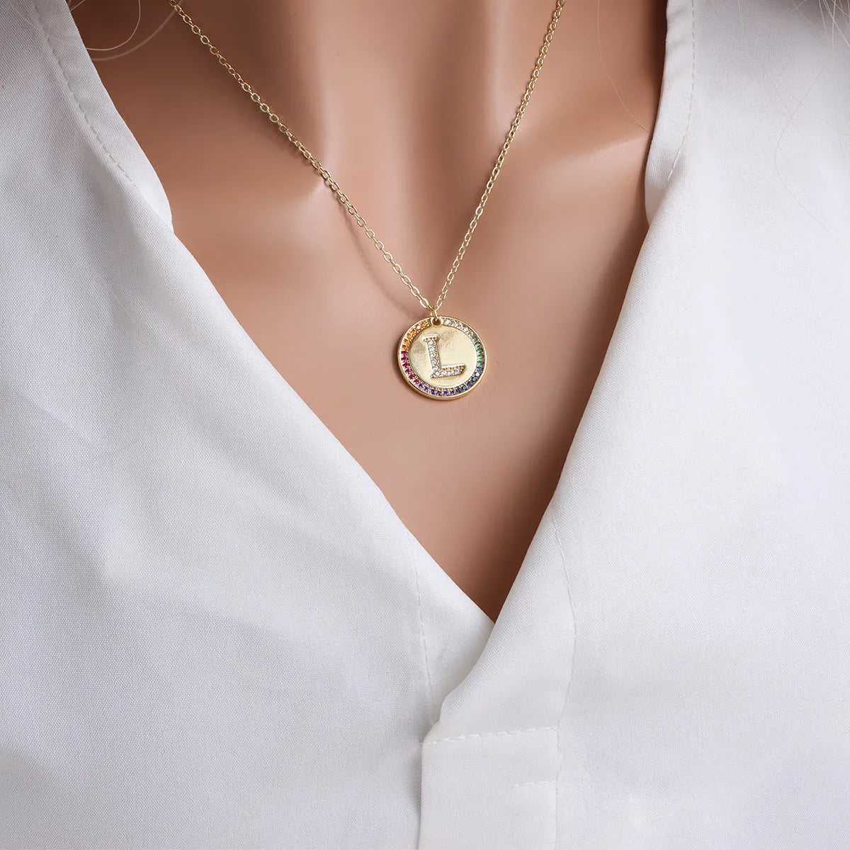 Gold English letter round pendant necklace with colourful crystals on clavicle length chain