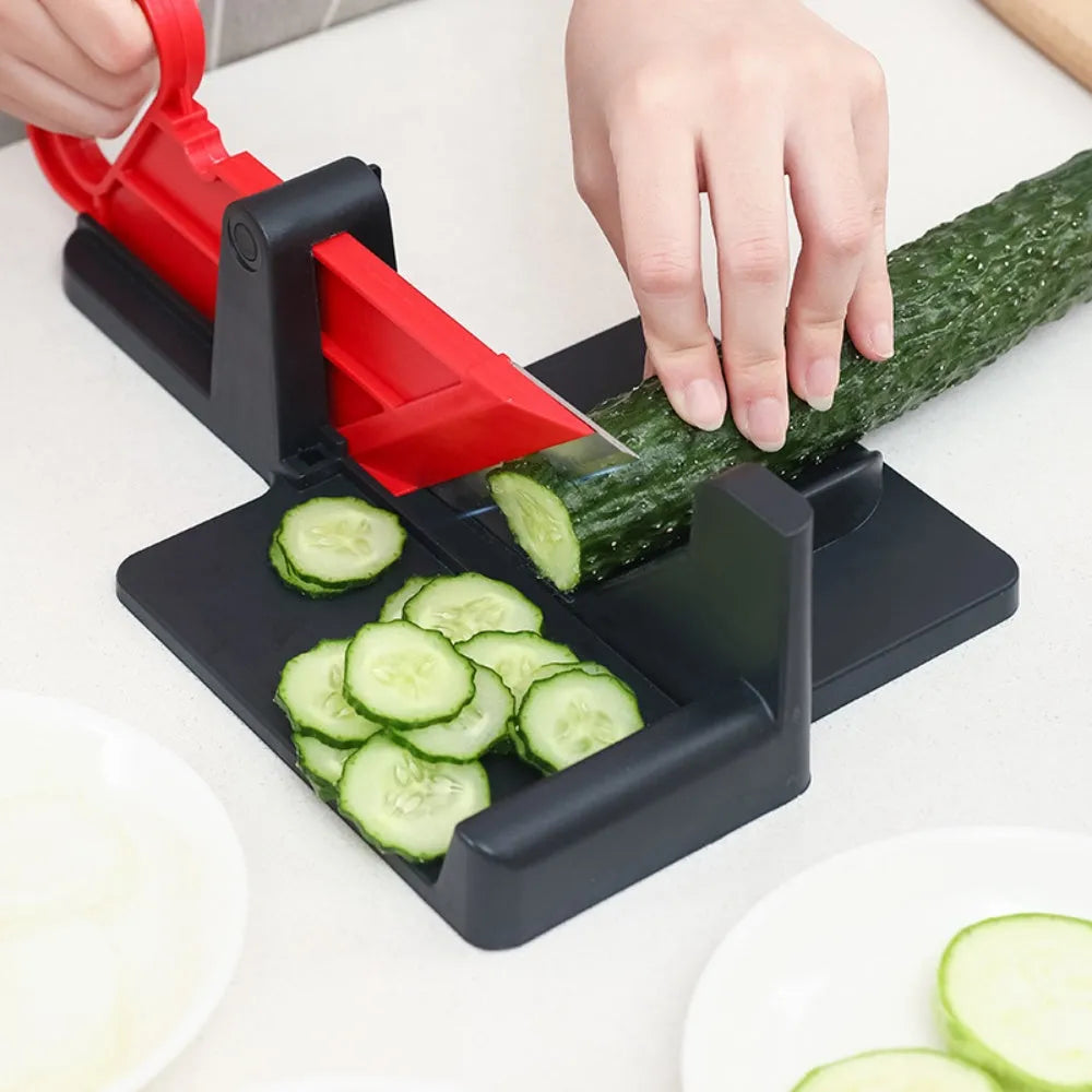 Green and red modern vegetable cutter with stainless steel blades for cutting carrots and potatoes.