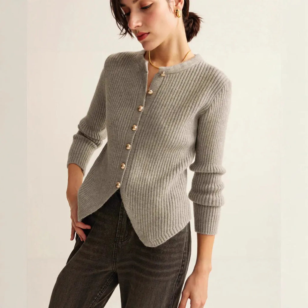 Red loose-fit cardigan sweater with a yarn collar on a hanger