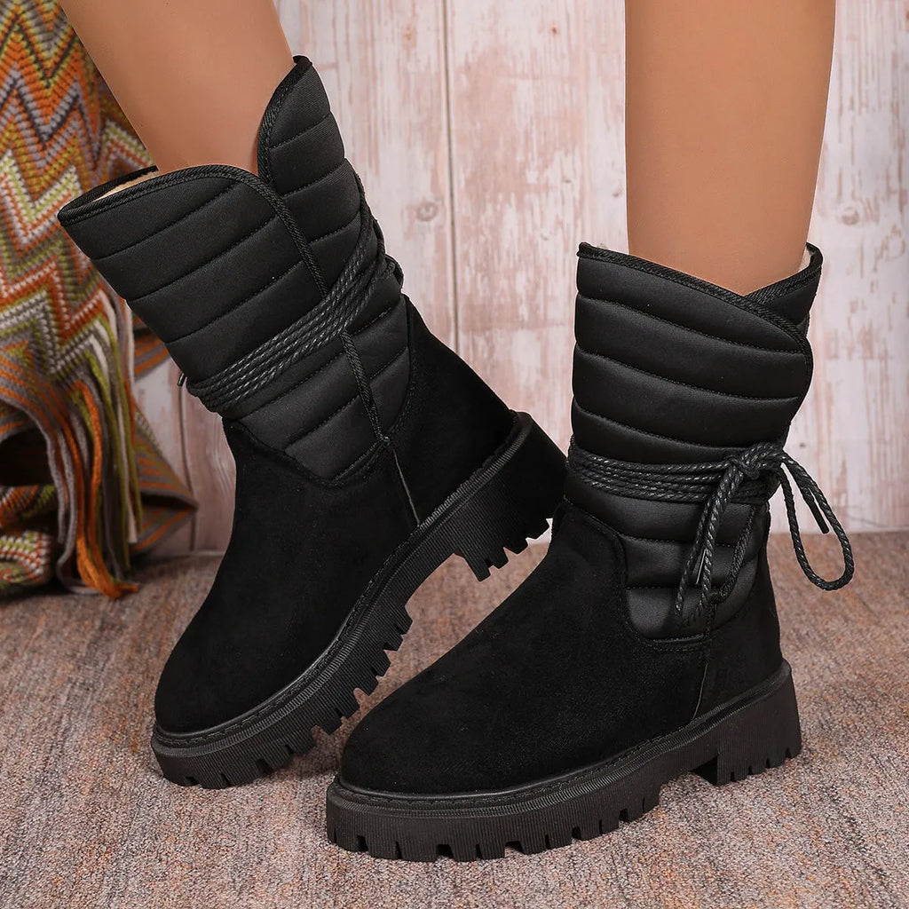 Women's black suede chunky heel snow boots with lace-up high-top design and fleece lining.