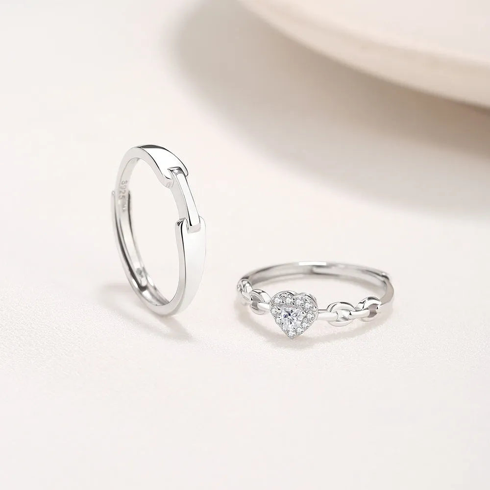 925 silver couple ring with diamond detail and adjustable opening, geometric shape with heart and chain motifs
