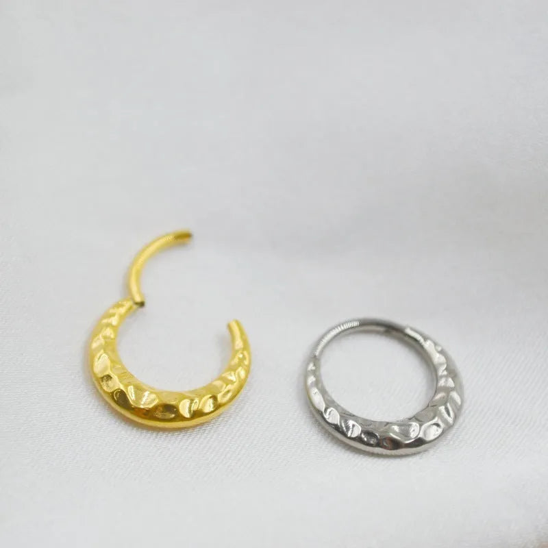 Titanium alloy concave-convex nose ring in gold or silver finish with 1.2mm thickness and 8mm or 10mm diameter options