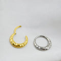 Titanium alloy concave-convex nose ring in gold or silver finish with 1.2mm thickness and 8mm or 10mm diameter options
