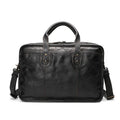 Brown vintage leather men's briefcase open showing internal laptop sleeve and multiple organisation pockets
