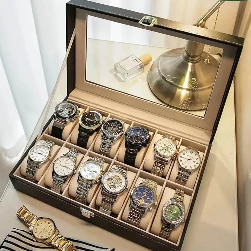 Grey leather watch storage box with a transparent dust cover, showing internal watch slots.