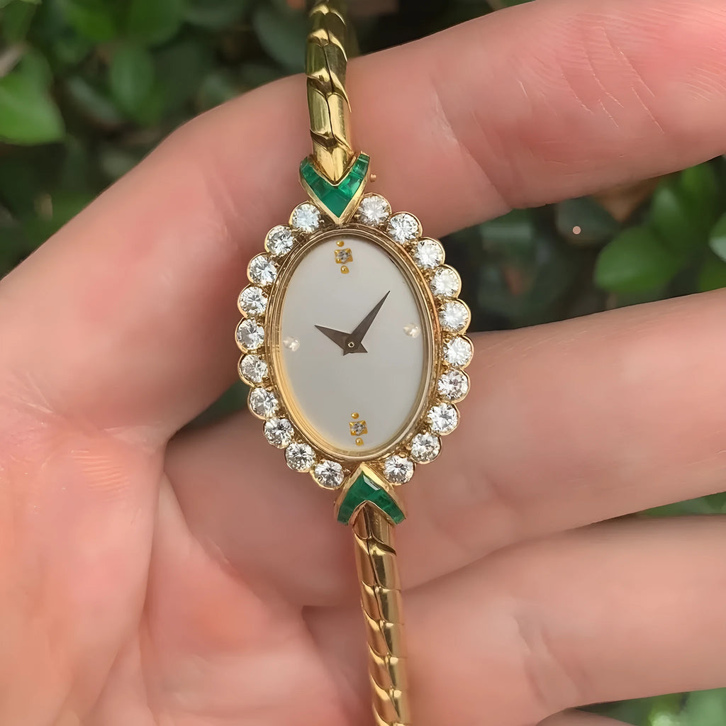 European small gold women's watch with handmade rhinestone inlay on a white background