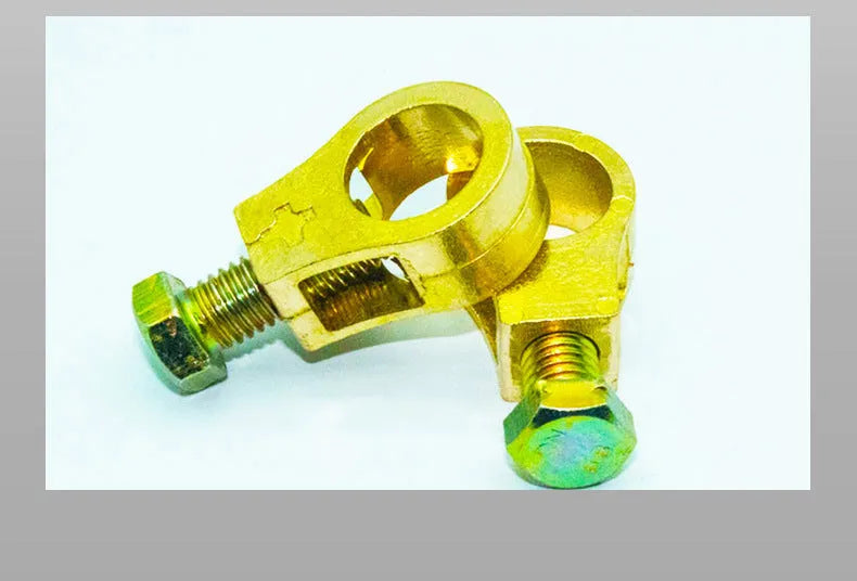 Solid copper battery terminal clamp with patented fastening clip for car battery connections.