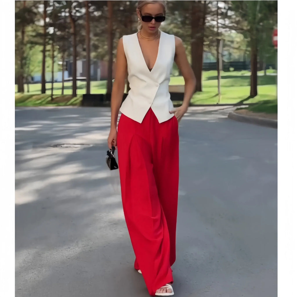 Women's beige polyester two-piece set with sleeveless deep V-neck top and high-waist wide-leg trousers.