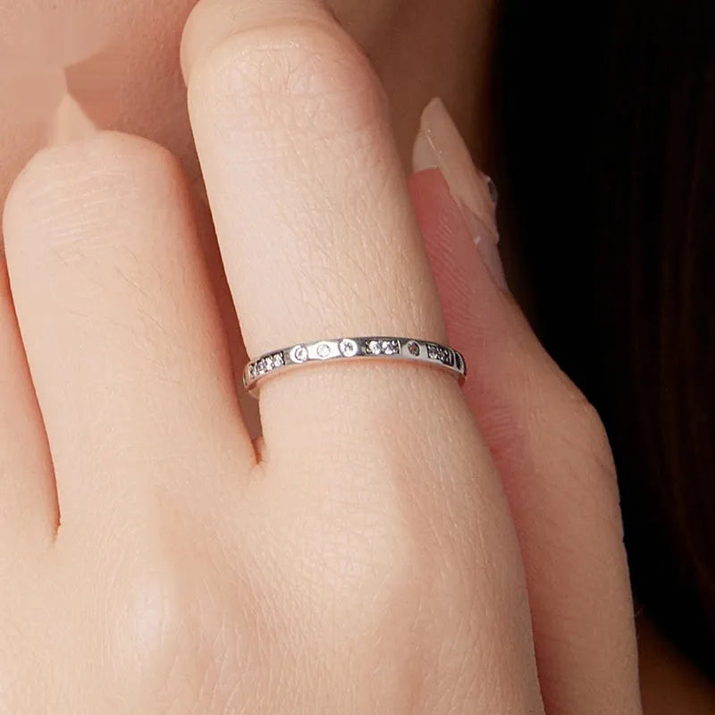 Moss Password I Love You silver alloy ring with oxidised black finish, shown in women's sizes.
