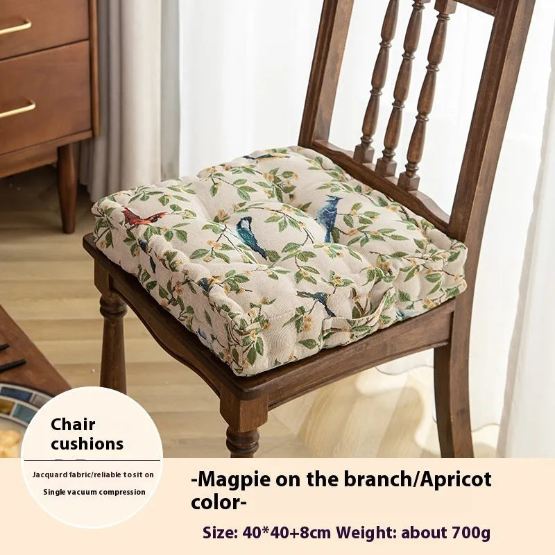 American-style square dining chair cushion with thick padding and botanical print.