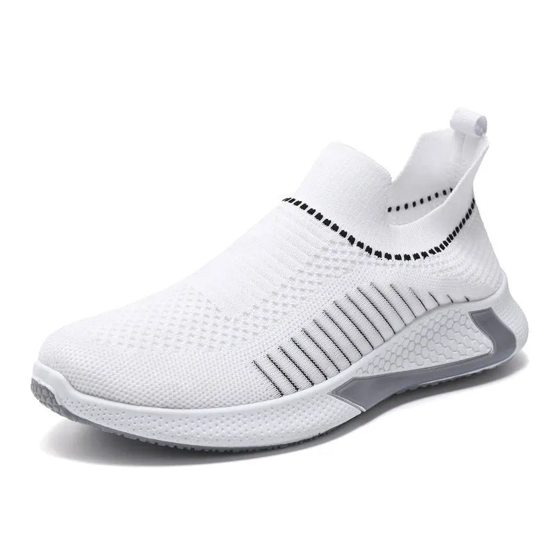 Men's black and white Flyknit mesh sneakers with lace-up front on a flat sole.