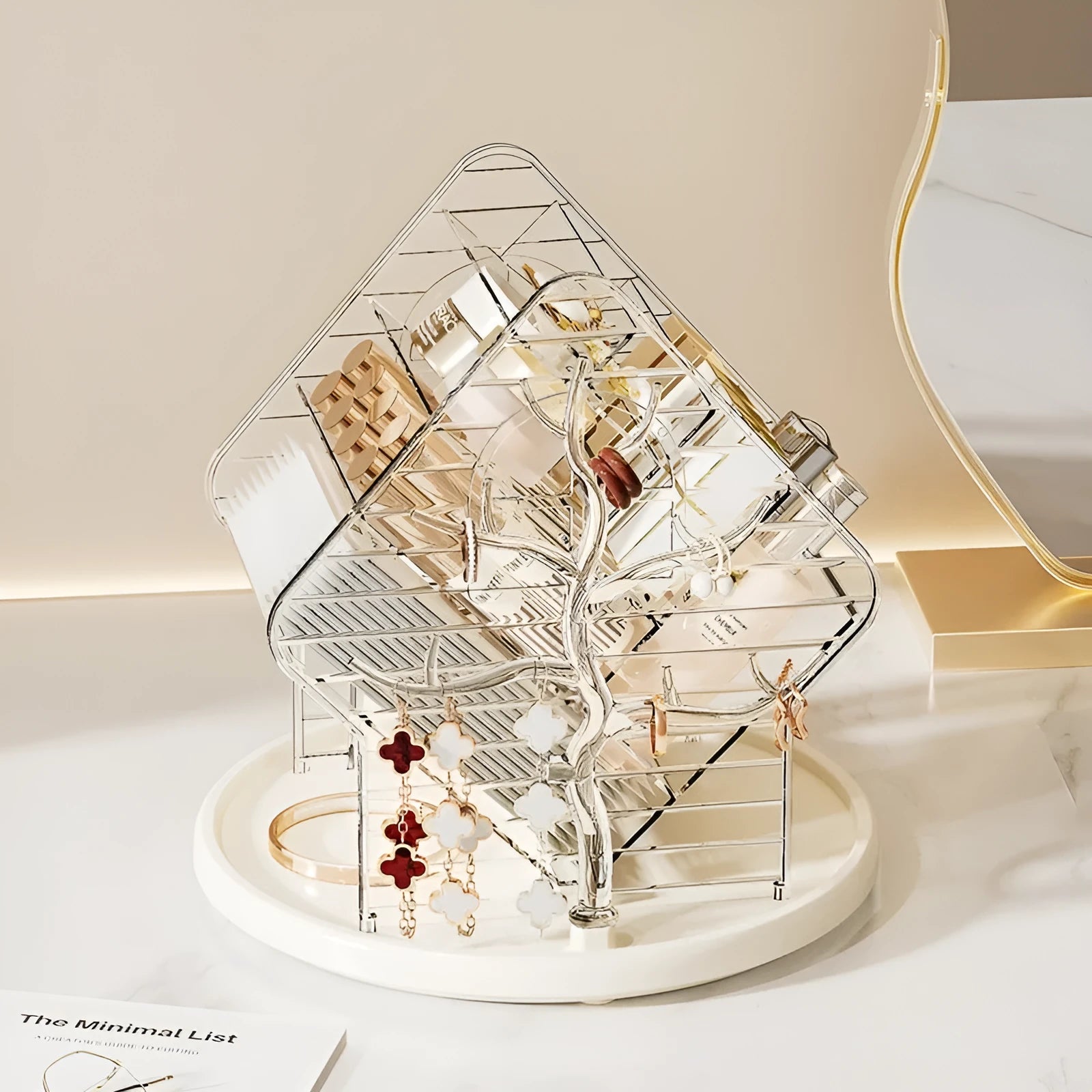 Transparent plastic rotating cosmetics storage box in clear and amber gold colour on a vanity table.