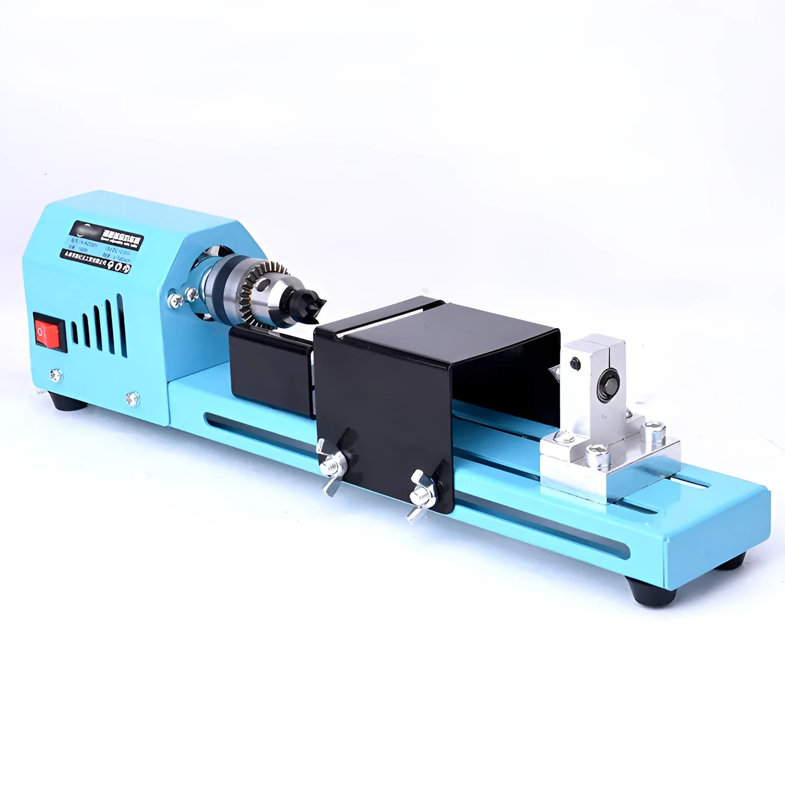Mini woodworking lathe in blue with steel chuck, drill bit, and protective cover on a desktop