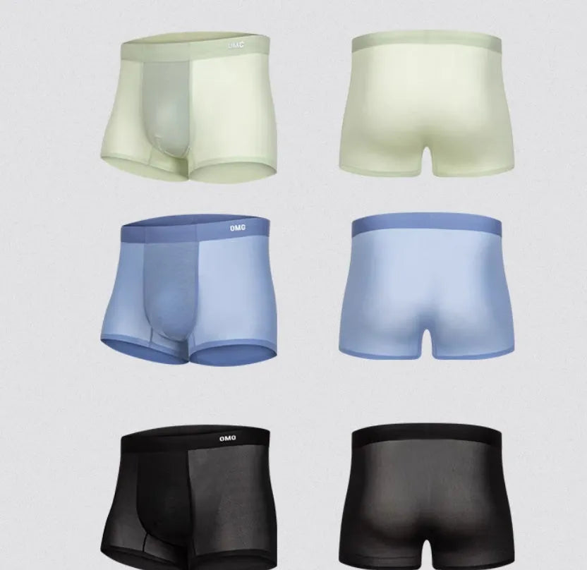 Seamless antibacterial fitness shorts in colours green, black, blue, and silver on a size chart.