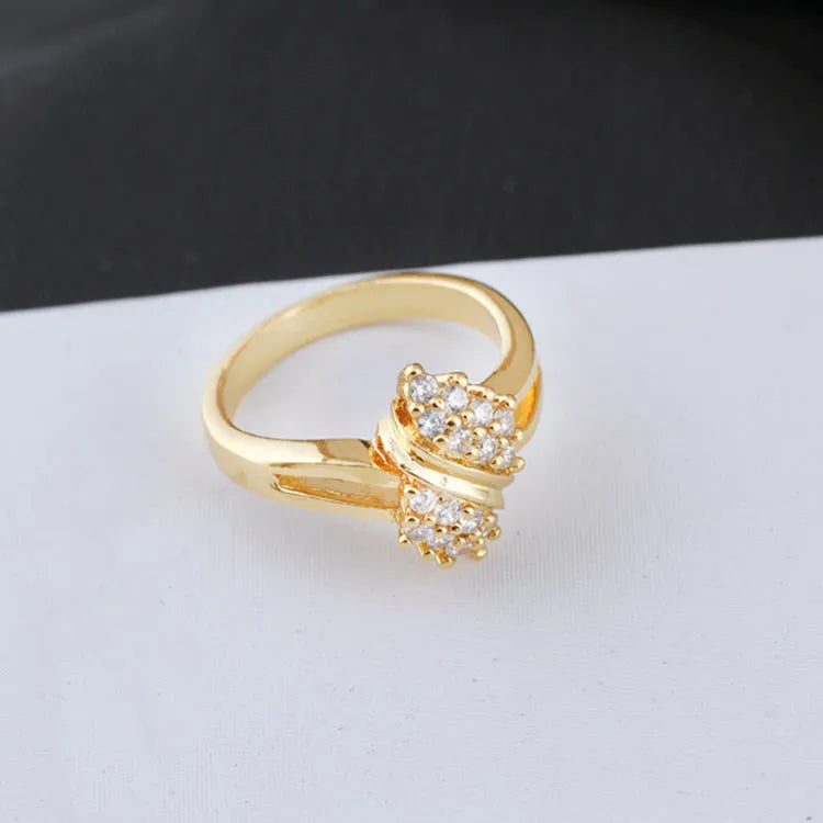 Girls fashion Korean style gold-coloured copper zircon ring on white background