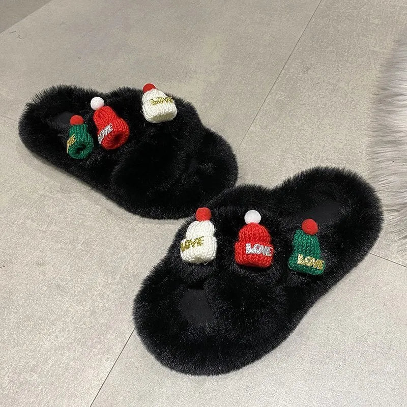 Women's black faux plush slippers designed like a Christmas hat with a rubber sole.