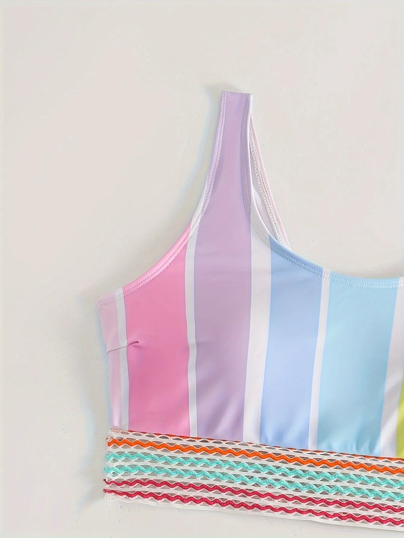 Women's striped bikini top and briefs in picture colour, laid flat to show pattern and style.