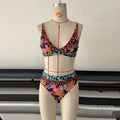 Women's high-waisted floral print bikini set on a mannequin.